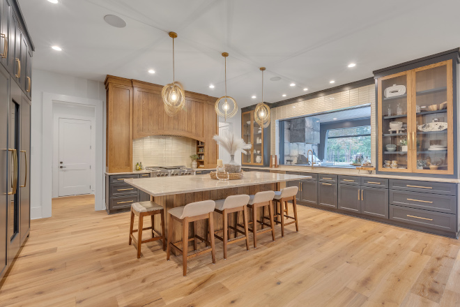 We started this kitchen design with the hood We wanted it to be showstopping but practical for everyday use You can see the shelves hidden away on the inside for spices and oils #kitchen #kitchenhood #kitchendesign