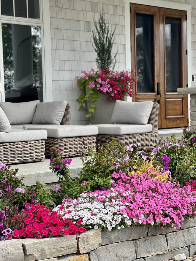 Front Porch Landscaping I’m always finding new areas to landscape so I can add more color I love being surrounded by flowers and having the extra bonus of fresh cut flowers throughout our home all summer long garden beds #FrontPorch #Landscaping #garden #gardenbeds