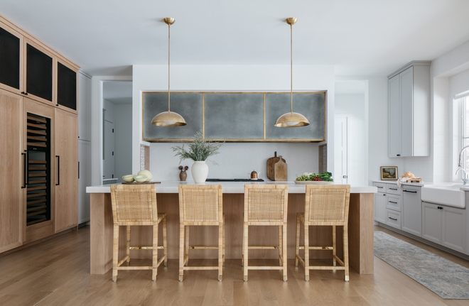 White oak Kitchen design Featuring a combination of White Oak and light grey cabinets What a fun combo this is and a breathtaking custom zinc hood vent with brass trim this kitchen really feels fresh and thought-out White oak Kitchen design #WhiteoakKitchen #WhiteoakKitchendesign