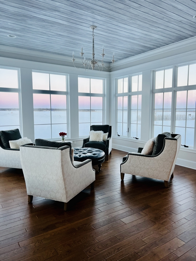 Our sunroom ceiling is a custom wood plank that we designed to mimic our white-washed cedar siding on the front exterior of our house #sunroom #ceiling