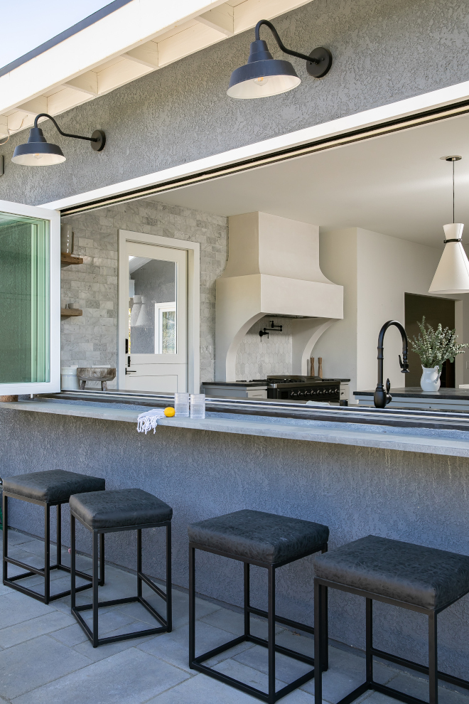 Kitchen features a pass-through window creating an outdoor bar