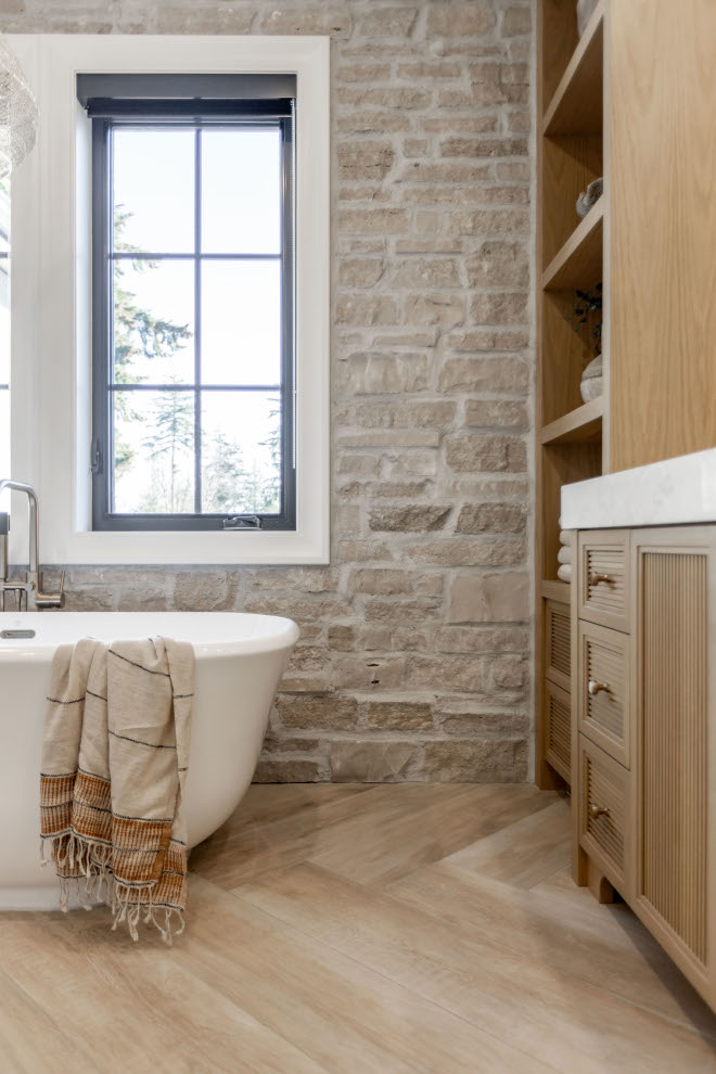 One of the biggest highlight in our Primary bathroom is this stone feature wall we did in behind the tub # highlight #Primarybathroom #bathroom bathroomstonewall #stone #featurewall #tub