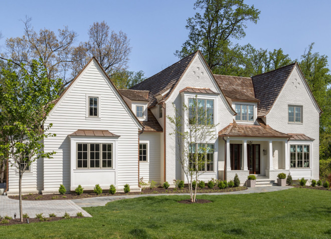 This home seamlessly blends the romanticism of a Tudor home with clean transitional lines creating a Modern Tudor aesthetic expressed through painted brick steeply pitched roof lines #home #Tudor #tudorhome #transitionallines #ModernTudor #paintedbrick #pitchedroof #architecture