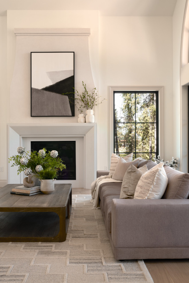 We plastered our fireplace in a soft taupe plaster and added a picture-framed limestone fireplace surround around our extra large 48 inch fireplace #plasterfireplace #fireplace #pictureframemantel #limestonemantel