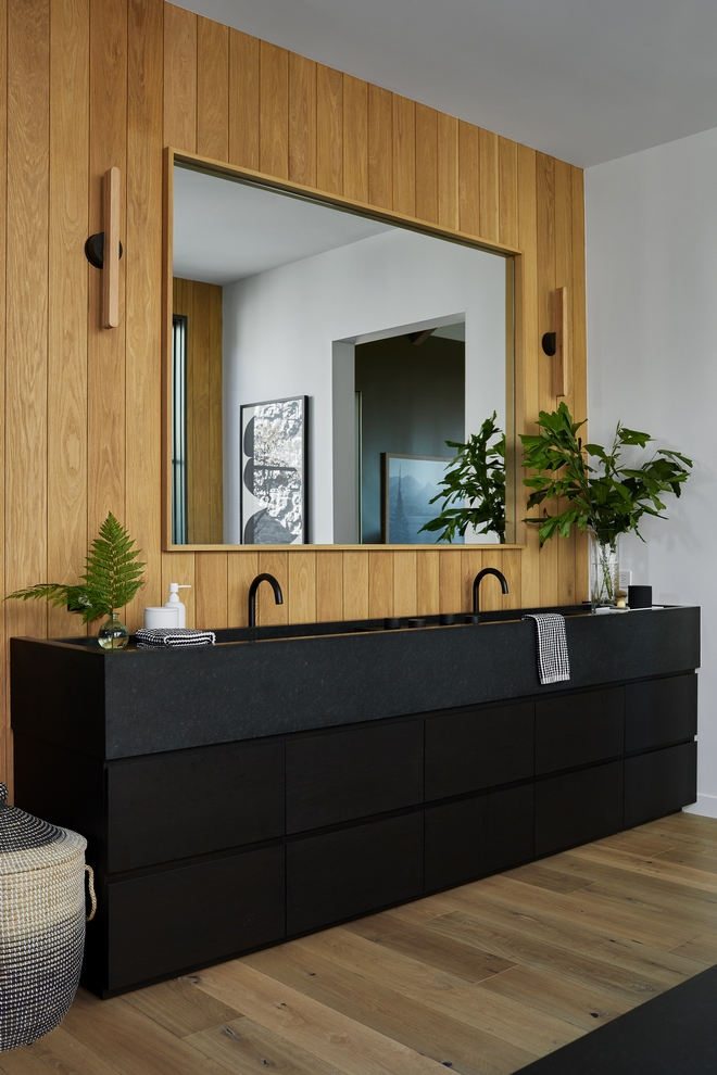 Bathroom features a large black vanity with drawers Leathered black granite countertop with integrated sinks and oak paneling complement this modern bathroom Bathroom features a large black vanity with drawers Leathered black granite countertop with integrated sinks and oak paneling complement this modern bathroom Bathroom features a large black vanity with drawers Leathered black granite countertop with integrated sinks and oak paneling complement this modern bathroom #Bathroom #largevanity #blackvanity #vanitywithdrawers #Leatheredblackgranite #countertop #integratedsink #oakpaneling #modernbathroom