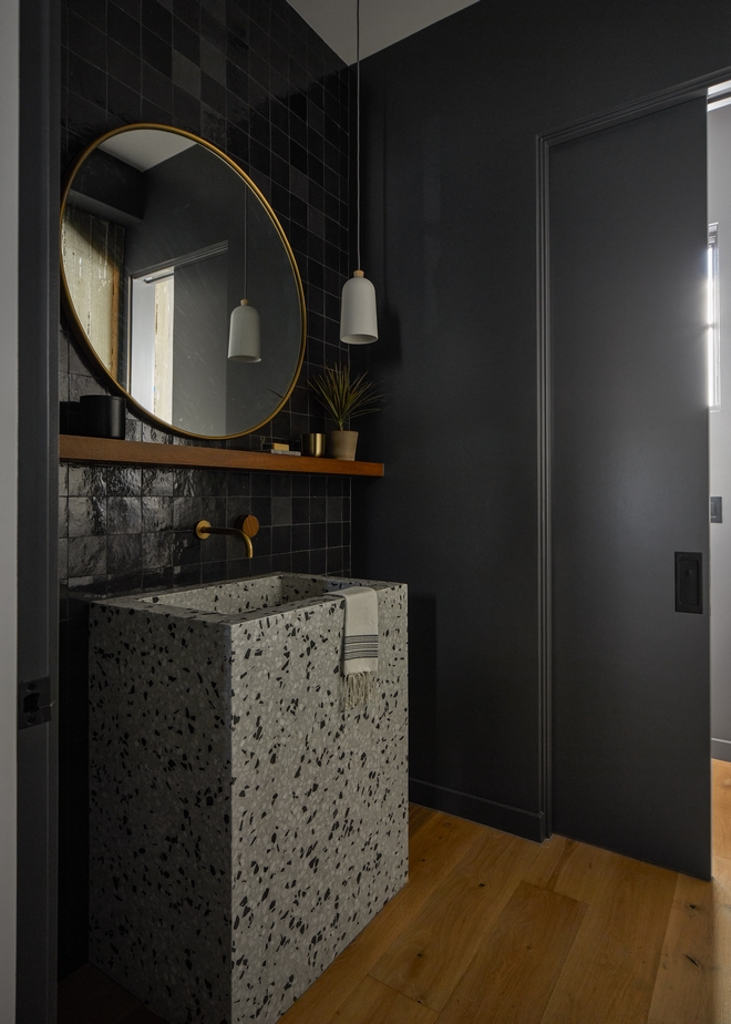 Powder room featuring Benjamin Moore Wrought Iron and cutom Terrazzo sink #BenjaminMooreWroughtIron #terrazzo