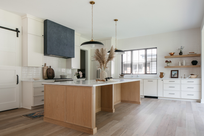A neutral white paint color on cabinets along with White Oak on the island, make this large kitchen feel warm and inviting #kitchen #neutral #whitepaintcolor #cabinets #WhiteOak #WhteOakisland #largekitchen #warmkitchen #invitingkitchen
