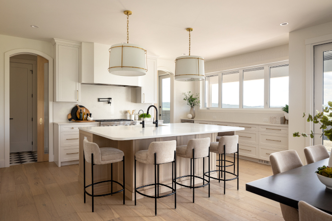 Kitchen Archways flanking the range cabinet leads you to a Mudroom on the left and a stunning walk-in pantry on the right #Kitchen #Archways #rangecabinet #Mudroom #walkinpantry