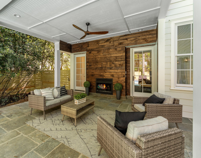 Back porch with reclaimed shiplap siding and fireplace