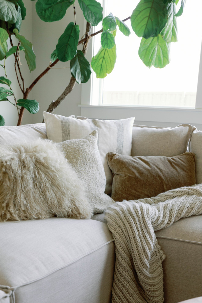 Comfortable interior design ideas this room features layers of white taupe and cream with heavy texture to feel supremely cozy and perfect for the days when a good book and a warm drink are all you need #Comfortable #interiordesignideas #layers #white #taupe #cream #textures #cozy