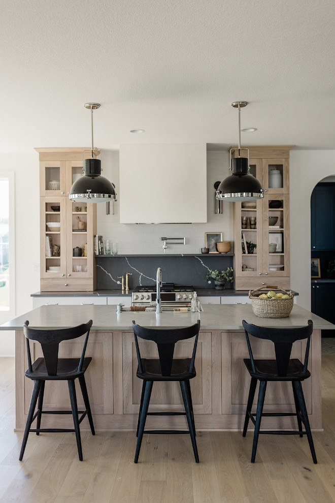 Counter-to-ceiling cabinets flanking the range hood add extra storage space and character to this newly-built kitchen Counter-to-ceiling cabinets flanking the range hood add extra storage space and character to this newly-built kitchen #Countertoceilingcabinet #kitchencabinets #rangehood #kitchenstorage #storagespace #kitchenwithcharacter #newlybuilt #kitchen