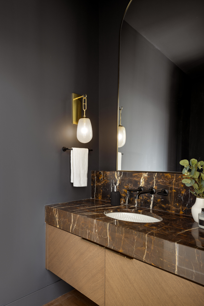 Floating vanity with Rift White Oak cabinetry and Michael Angelo marble countertop and backsplash #Floatingvanity #RiftWhiteOak #cabinetry #MichaelAngelo #marble #countertop #backsplash