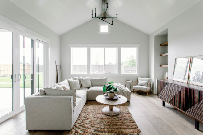 The family room features vaulted ceilings built in cabinetry and sliding glass doors leading to the oversized patio #greatroom #vaultedceilings #builtin #cabinetry #slidingglassdoors #patio