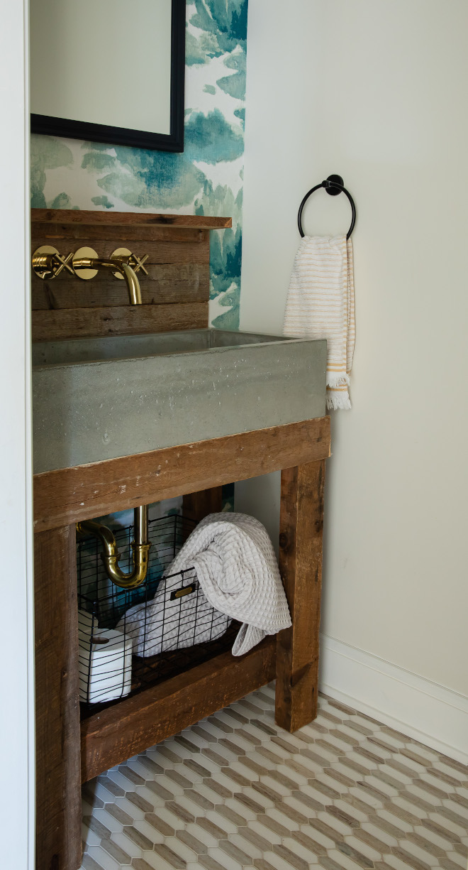 The powder room features a custom vanity made out of reclaimed Lumber and concrete sink The powder room features a custom vanity made out of reclaimed Lumber and concrete sink The powder room features a custom vanity made out of reclaimed Lumber and concrete sink #powderroom #reclaimedwoodvanity #reclaimedLumber #concretesink