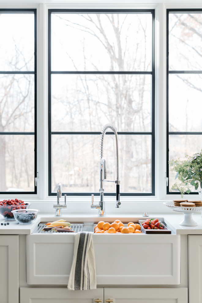 Kitchen sink window Windows were installed to the sink height to allow more natural light in and to create a more sleek look #sink #window #kitchenwindow