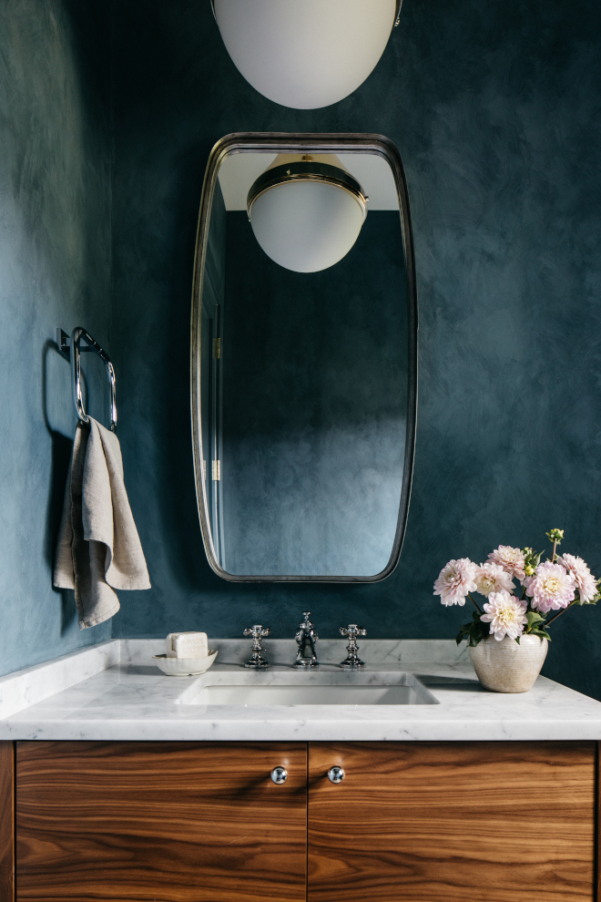 Powder room features a custom Walnut bathroom vanity with horizontal grain and walls on a lime-washed finish #Powderroom #Walnutbathroomvanity #horizontalgrain #cabinet