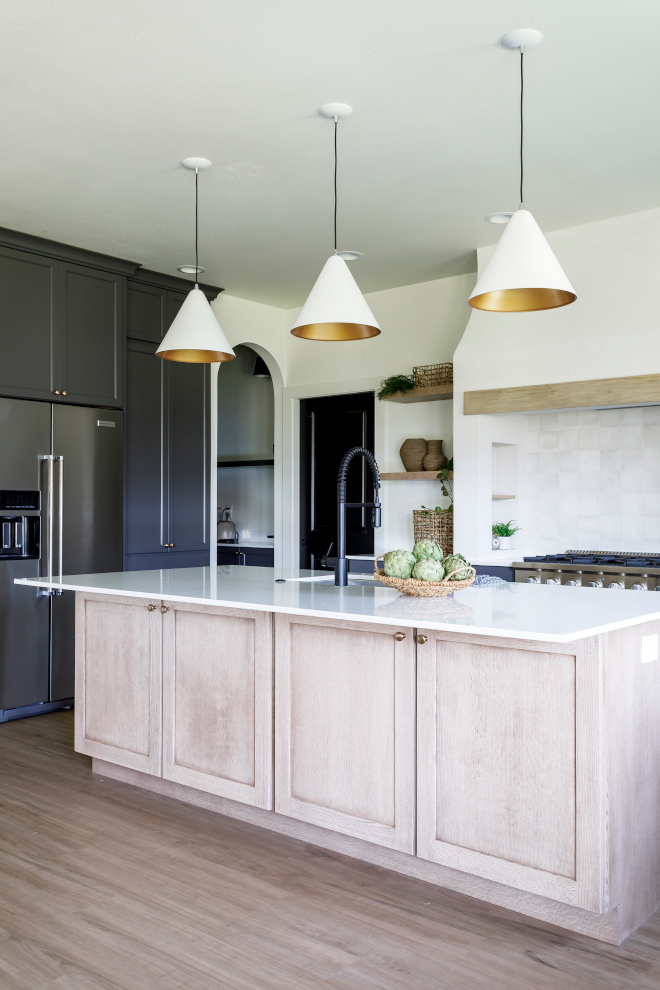 Shaker style Quarter Sawn Oak kitchen island highlighted with brass hardware on a white oak finish #Shakerstyle #QuarterSawnOak #kitchenisland #brasshardware #whiteoak #whiteoakfinish