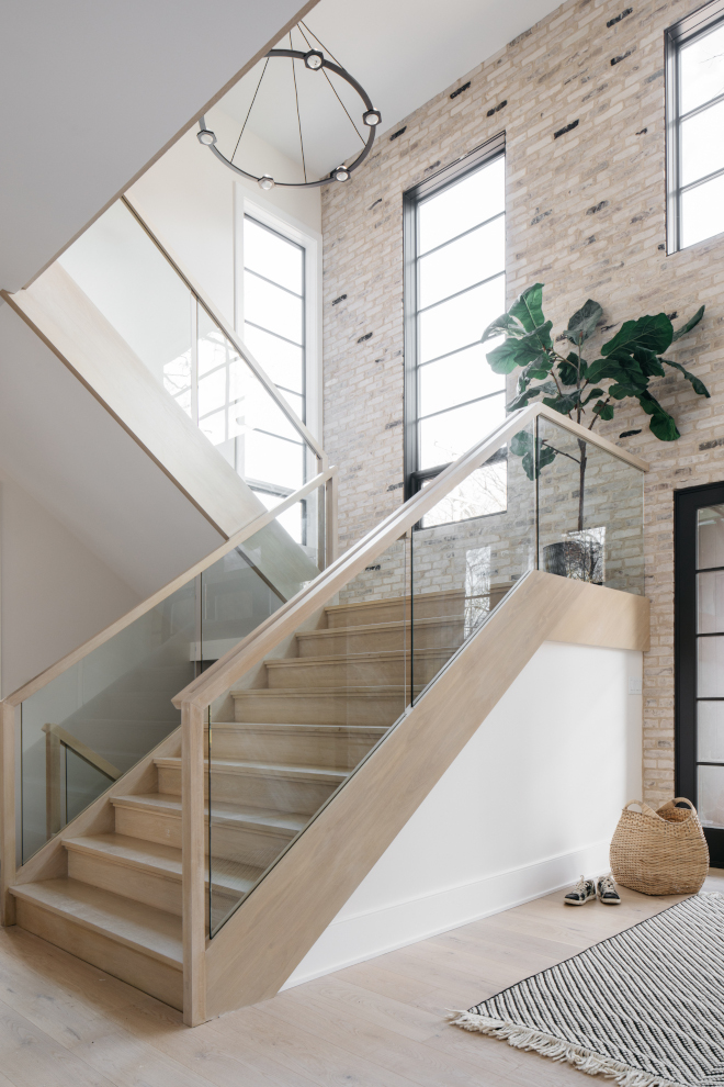 Staircase wall clad in ivory brick