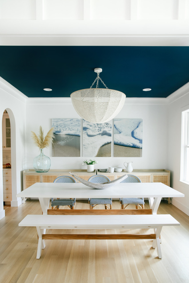 Blue and white dining room Bold and beautiful dining room with a relaxing coastal vibe painted ceiling in navy blue Blue and white dining room Bold and beautiful dining room with a relaxing coastal vibe painted ceiling in navy blue #Blueandwhite #diningroom #Boldandbeautiful #coastaldiningroom #relaxing #coastal #paintedblueceiling #blueceiling #navyblue