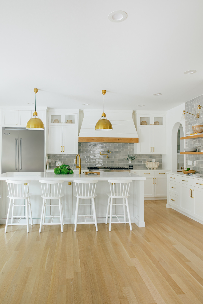 White Kitchen Grey Backsplash For the kitchen we selected a crackled subway and carried it over to a clean lined dry bar White Kitchen Grey Backsplash #WhiteKitchen #GreyBacksplash #Whitekitchenbacksplash