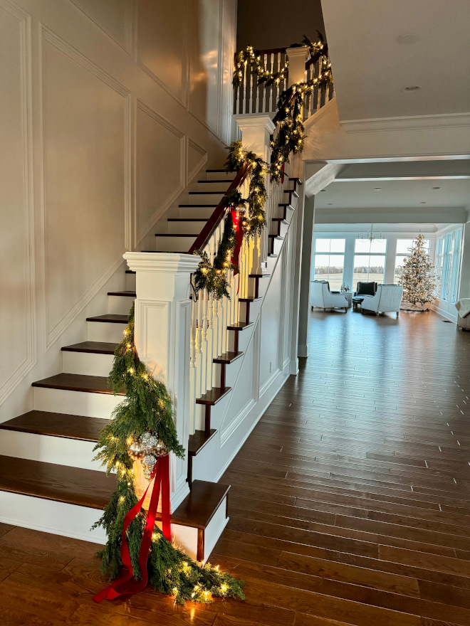 how to hang garland on railing Attach the garland to the banister with a zip tie every two feet Tips on how to hang garland on railing #howtohanggarlandonrailing