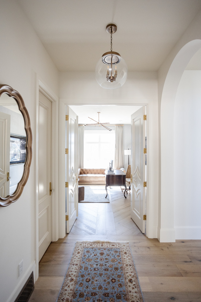 French doors welcome you into a beautiful study with hardwood floors laid in a custom design #Frenchdoors #study #hardwoodfloor