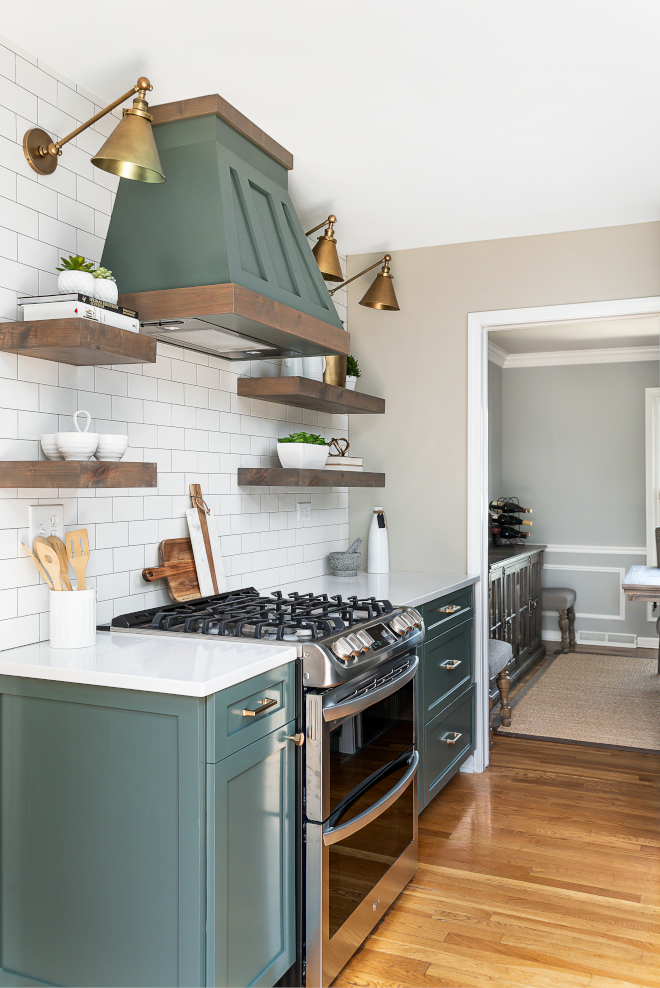 Kitchen Renovation We updated the original cabinets with a rich green paint color #KitchenRenovation #Kitchen #Renovation #OriginalCabinet #GreenPaintColor #PaintColor