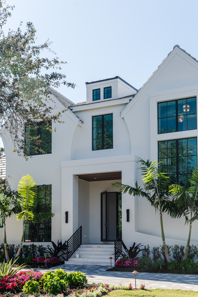 Stucco was selected as the exterior material and the builder added a dose of character by incorporating a flared end to each of the gables #stucco #gables #architecture