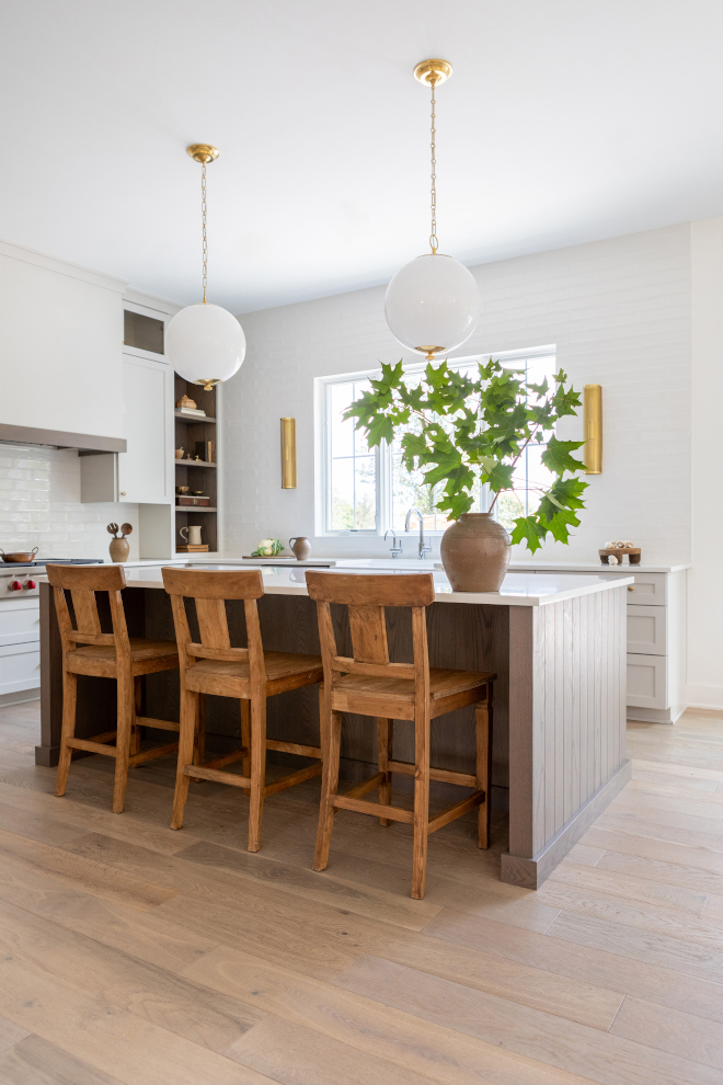 A fresh kitchen design featuring a beautiful white oak island and light grey cabinets #freshkitchendesign #beautiful #whiteoakisland #lightgreycabinets