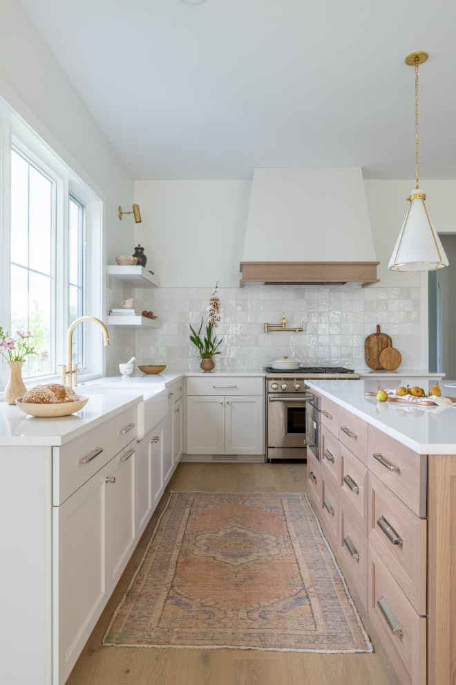 A textured backsplash tile creates a shimmery feeling that is soothing and quite enchanting in this kitchen #kitchen #shimmerytile #tile #backsplash