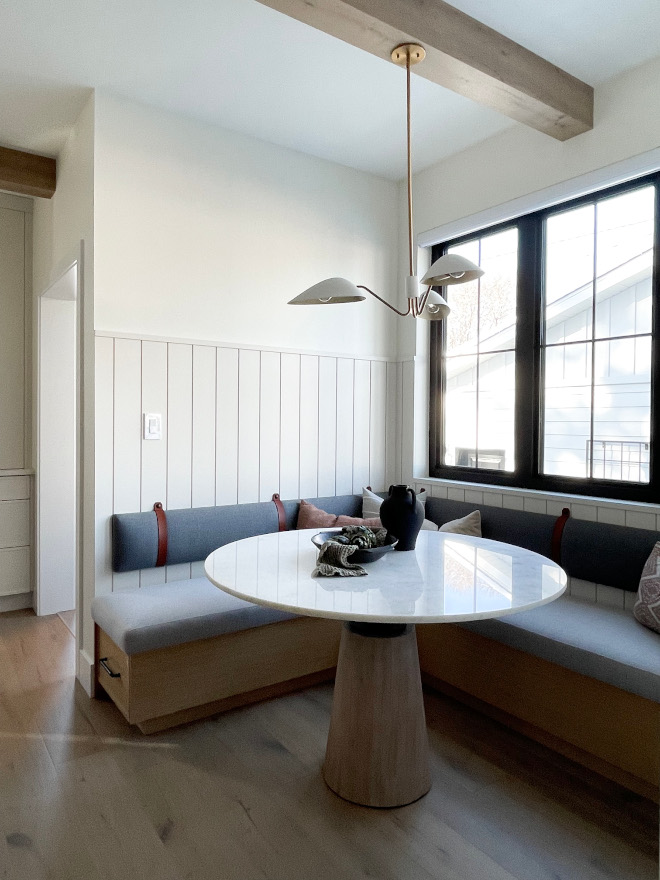 Breakfast Nook blend of white oak accents refined upholstery sleek black hardware charming tongue and groove wainscoting Breakfast Nook blend of white oak accents refined upholstery sleek black hardware charming tongue and groove wainscoting #BreakfastNook blend #whiteoak #tongueandgroove #wainscoting