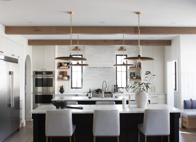 Kitchen featuring all-white design with touches of darkness for heightened contrast complemented by artisan tile accents quartz countertops #Kitchen #allwhite #design #contrast #tile #accents #quartz #countertop