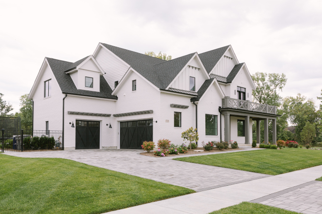 Modern farmhouse features painted brick board and batten siding and exquisite landscaping #Modernfarmhouse #paintedbrick #boardandbatten #siding #landscaping