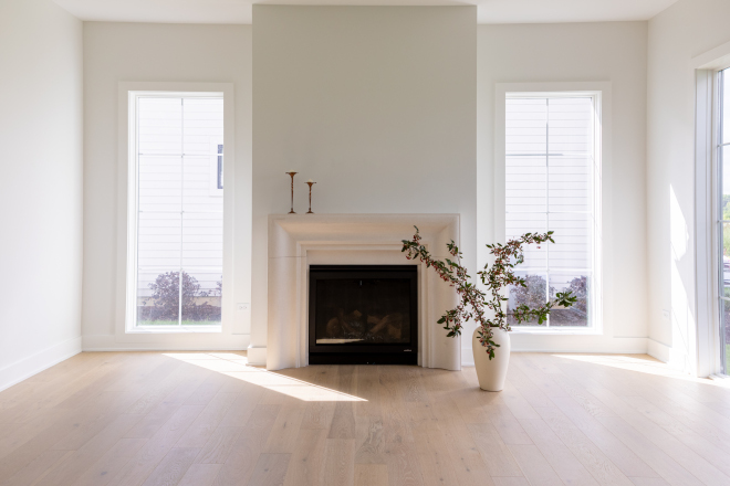 The large windows allow natural light to flood this living room creating a warm and inviting atmosphere #livingroom #windows