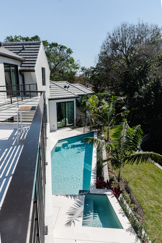 The sundeck is an incredible spot to lounge the day away while dipping into the pool and hot tub #sundeck #lounge #pool #hottub