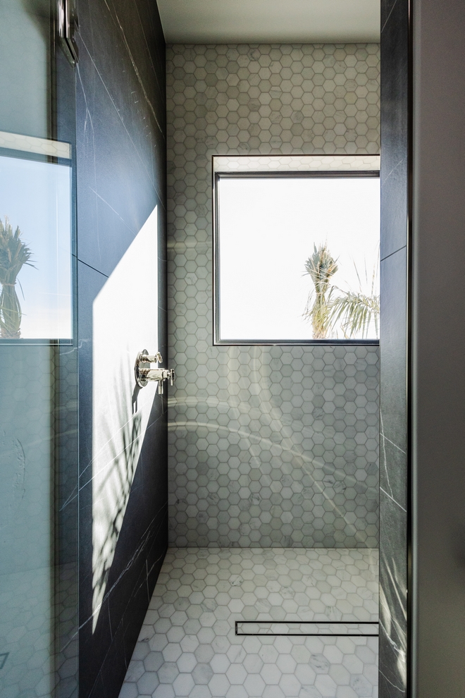 The sleek and seamless design of a curbless shower not only enhances the overall appearance of the space but also provides a sense of openness and accessibility