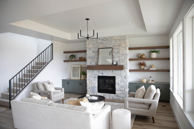 Living room with a stone fireplace and custom built-ins This is an attractive and functional addition to any living room #Livingroom #stonefireplace #builtins #functional