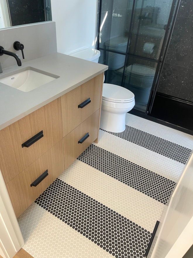 Embracing a dark and moody ambiance this design features white oak millwork paired with a sleek natural stone countertop and a stunning stone wall tile #design #whiteoak #millwork #countertop