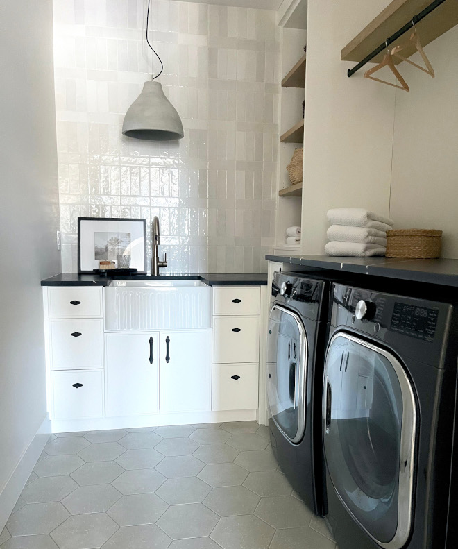 Laundry Room The white oak shelf offers storage while a matte black drying rod ensures convenience and organization #LaundryRoom #whiteoakshelf #storage #organization Laundry-Room-white-oak-shelf-storage-drying-rod-organization