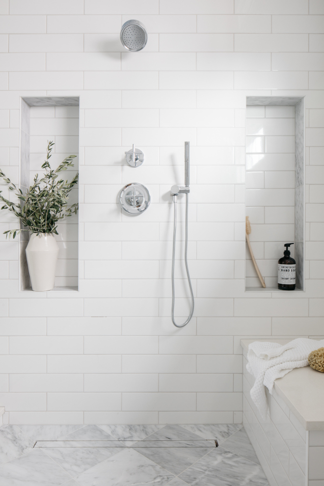 Shower with white subway tile combined with 12x12 marble floor tile