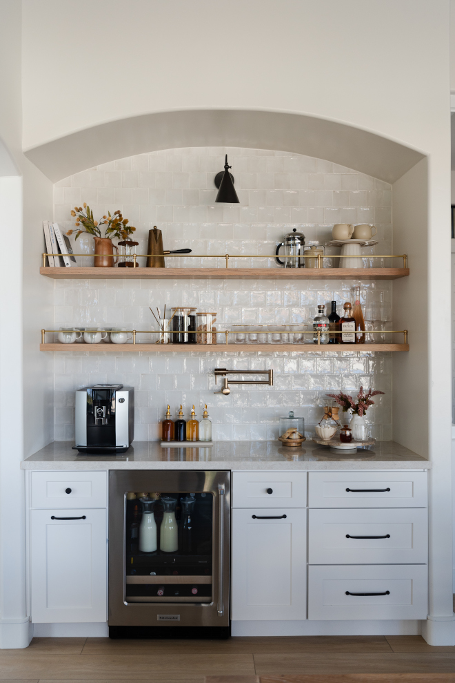 We carried over the shaker perimeter cabinets painted in Sherwin Williams White Heron from the kitchen to this small but impactful bar area #bar #bararea #SherwinWilliamsWhiteHeron