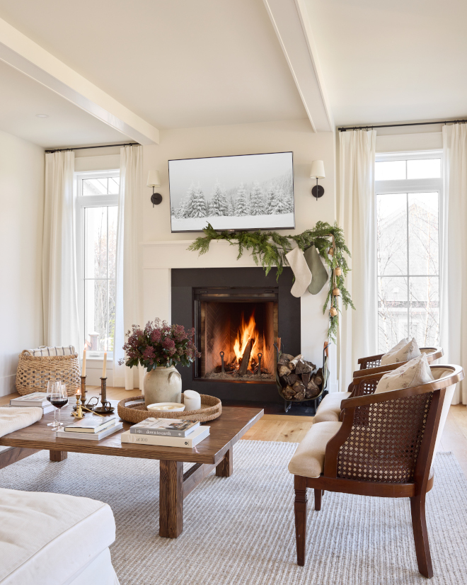 Simple Christmas Fireplace Decor Ideas A single Cedar garland along with golden bells is cascaded on the mantel #SimpleChristmasdecor #ChristmasFireplaceDecorIdeas #FireplaceDecorIdeas #Cedargarland #goldenbells #mantel