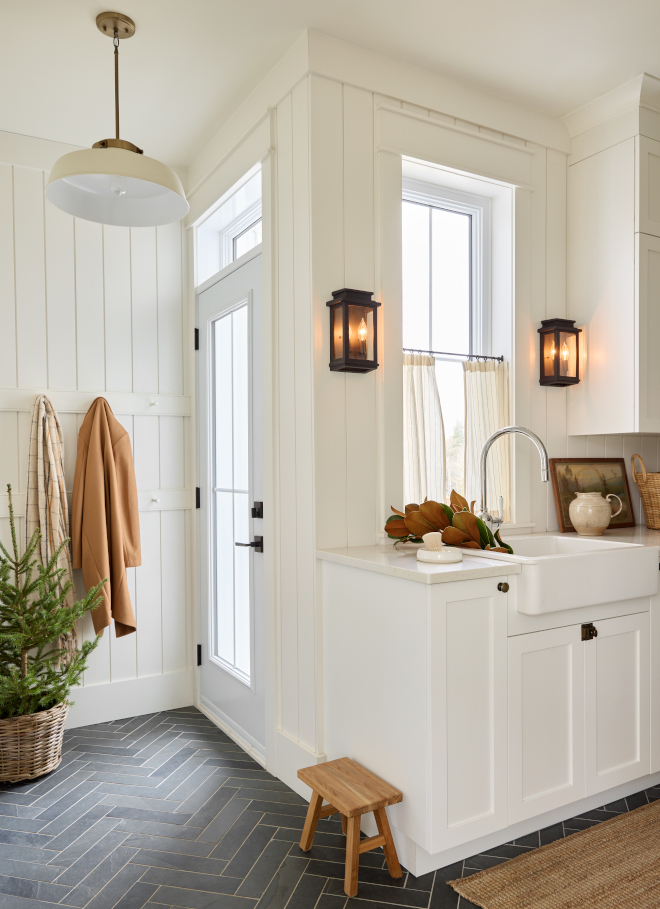 White Laundry Room with beautiful and durable slate floor tile laid in herringbone pattern along with vertical shiplap walls White Laundry Room with beautiful and durable slate floor tile laid in herringbone pattern along with vertical shiplap walls #WhiteLaundryRoom #LaundryRoom #beautiful #durable #slatefloortile #herringbonepattern #verticalshiplap