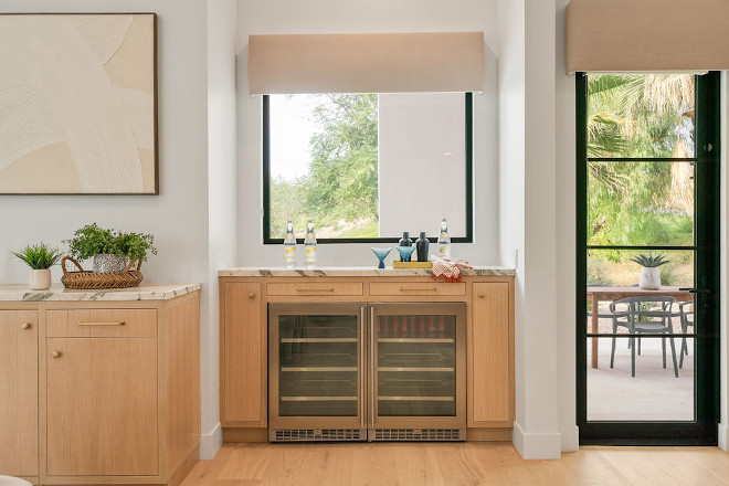 Kitchen Bar with white oak cabinets and a pair of beverage refrigerators #Kitchen #Bar #whiteoak #barcabinet #beveragefridge #refrigerator