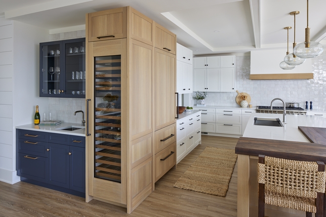Moving the bar to just outside the main kitchen space was intentional so when entertaining the flow of people can extend beyond the kitchen so not everyone is crowded around the island