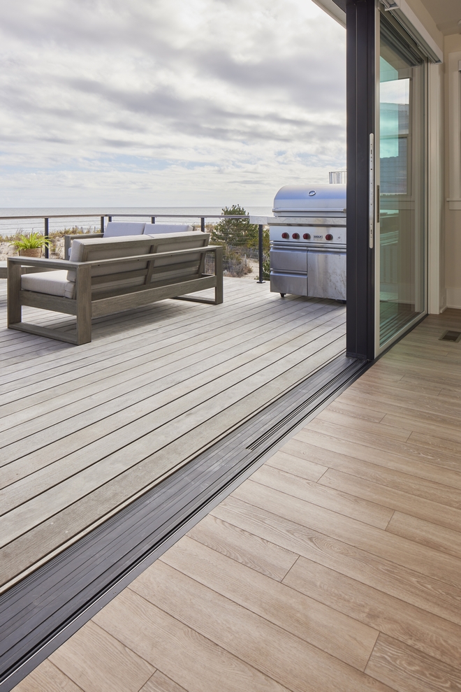 Seamless Patio Door massive multi-slide doors open wide to let in the ocean breeze and flow into the outdoor dining area #patiodoor #deck
