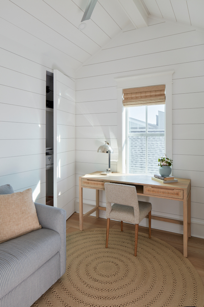 custom concealed storage closet perfectly complements the aesthetics of this seaside home office #homeoffice #concealedstorage #storage