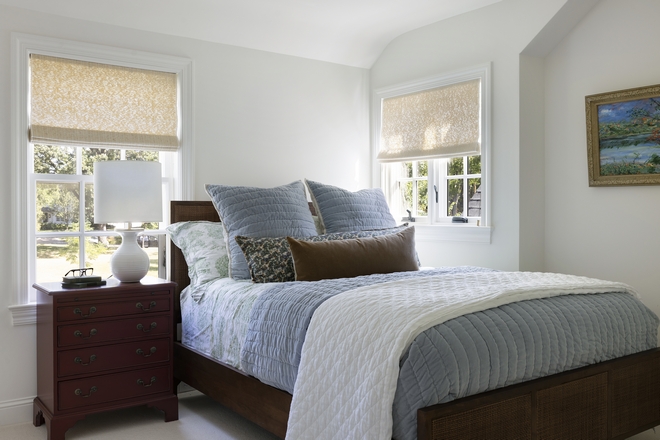 In this guest bedroom timeless elements are enhanced by a contemporary touch highlighted by the cane bed