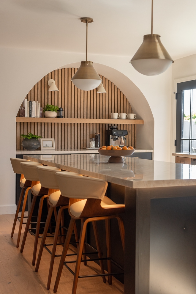 This beautiful and soothing kitchen has plenty of inspiring design ideas which include a coffee bar tucked into an arched nook #kitchen #neutrals #coffeebar #arch
