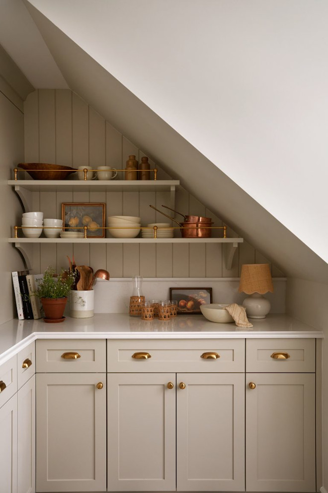 Revere Pewter painted pantry cabinets styled with French country kitchen essentials and brass railings.